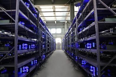 Cryptocurrency mining farm with rows of mining rigs working