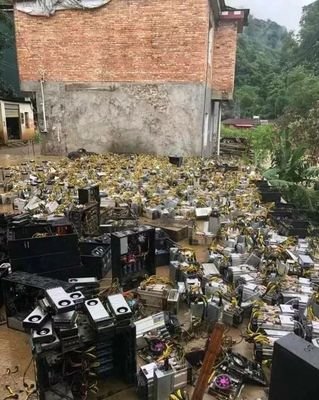 A sprawling cryptocurrency mining farm illuminated with LED lights