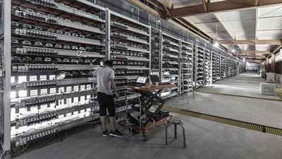 A sprawling mining farm in Nigeria, showcasing rows of mining machines humming with activity.