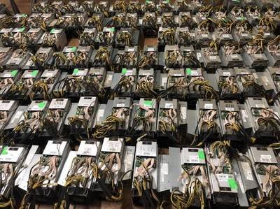 A rack of powerful mining rigs humming with activity in a professional hosting facility.